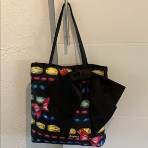 Brighton “ribbon” tote with large blk satin bow.
